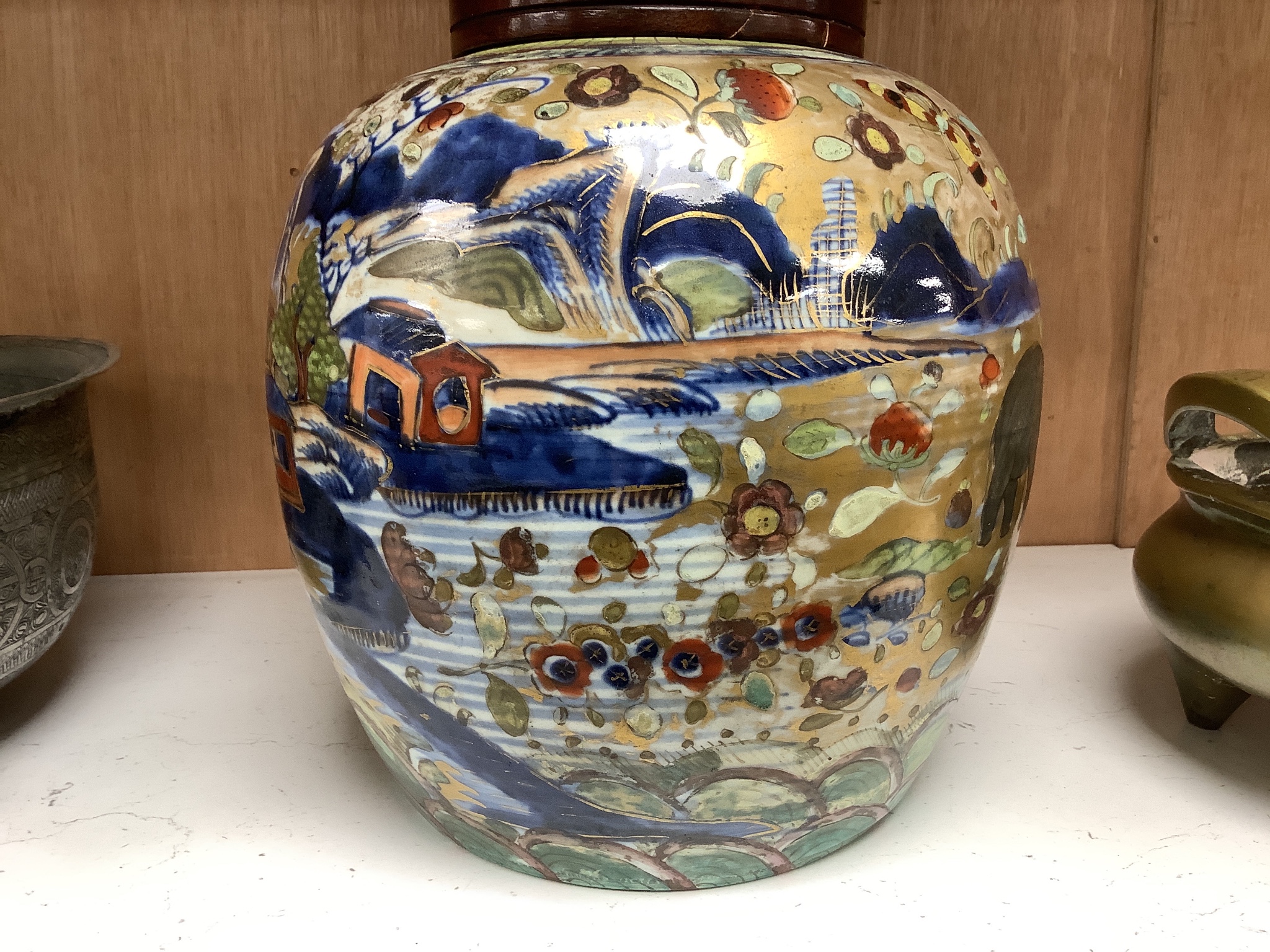 A 19th century Chinese clobbered jar with wood cover 24cm